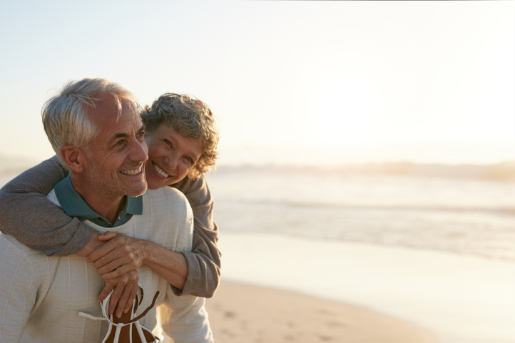 Houston couple reviewing an indexed universal life insurance policy with an Impact! Partners Financial advisor