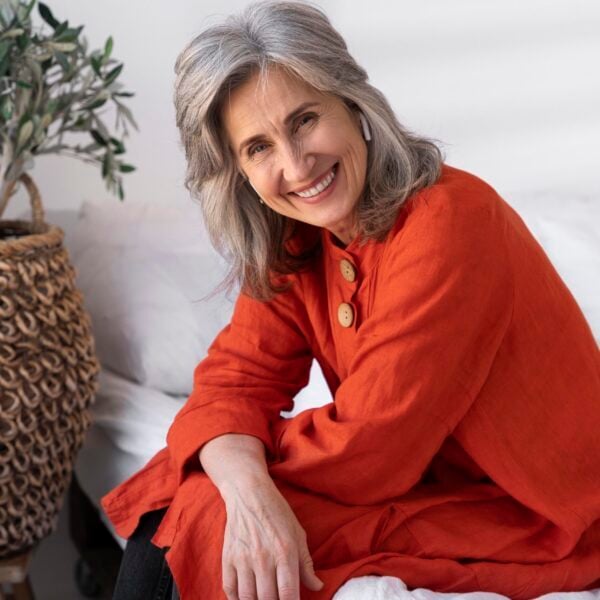 Woman in red smiling Woman in red smiling